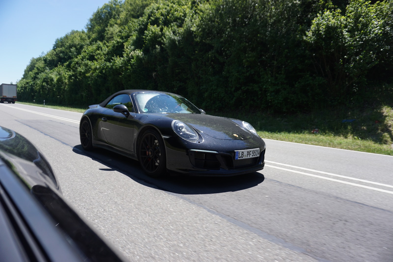 Porsche 911 driving on autobahn