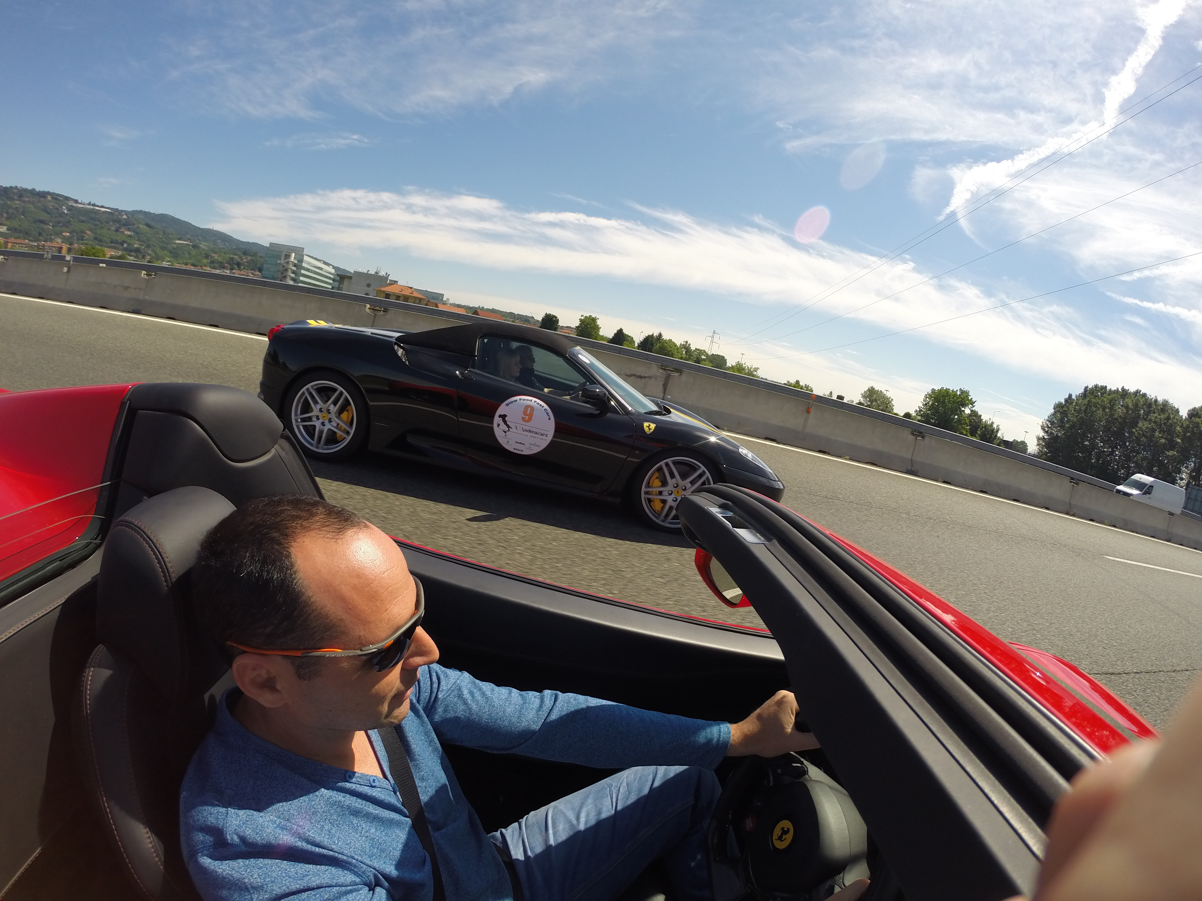 Ferrari chasing Porsche on highway