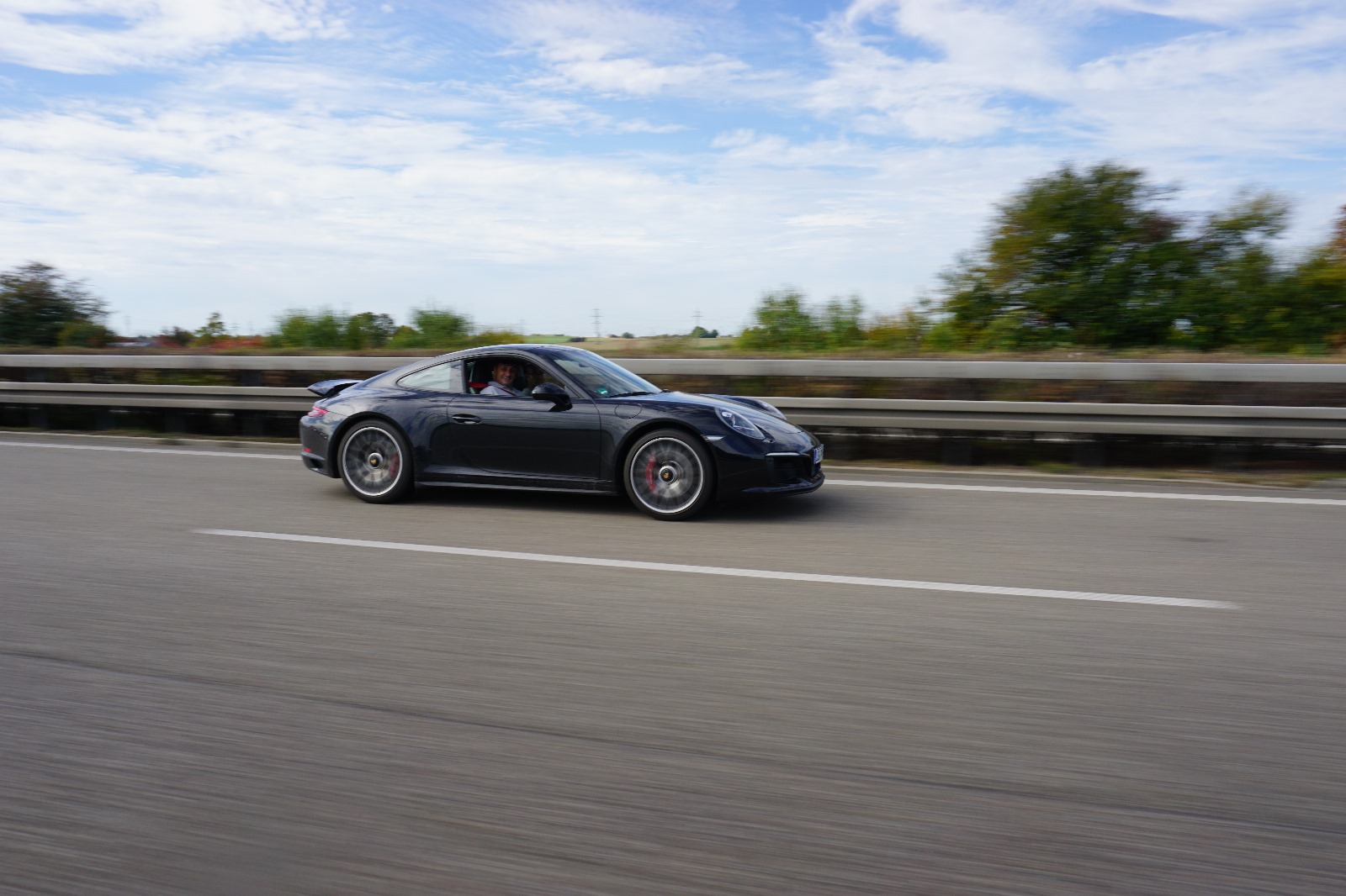 Porsche 911 at speed with motion blur